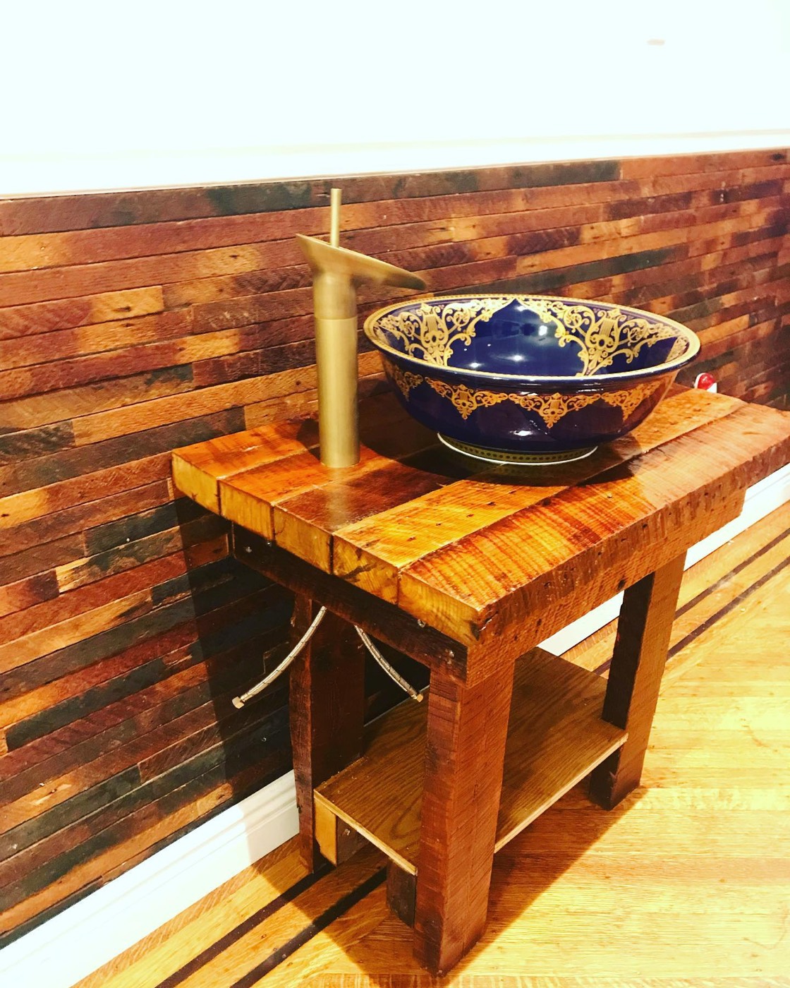 Custom reclaimed-wood vanity with vessel sink