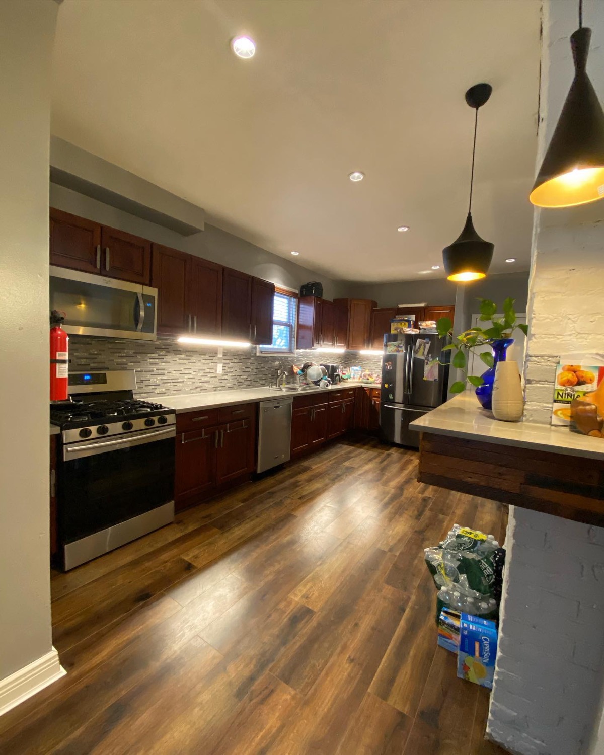 Finished kitchen with cherry cabinets and new lighting